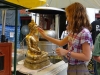 120625-00547-th-bangkok-wat-phra-kaew-placing-goldleaf-on-buddha