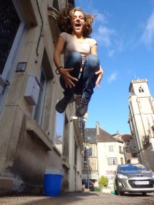 Eryn Leaps Into the Air In Front of Notre Dame Cathedral